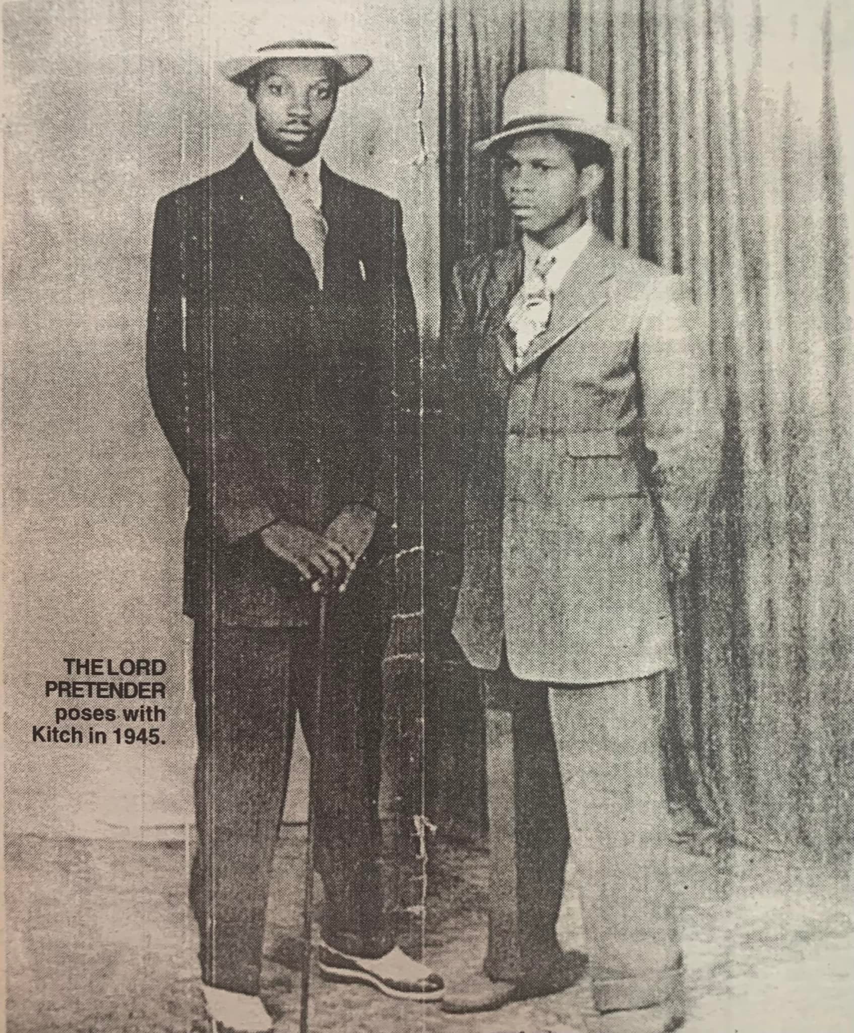 Archival 1945 newspaper photograph of a young Lord Kitchener and fellow calypsonian Lord Pretender standing side by side in suits and hats, captioned 'The Lord Pretender poses with Kitch in 1945'